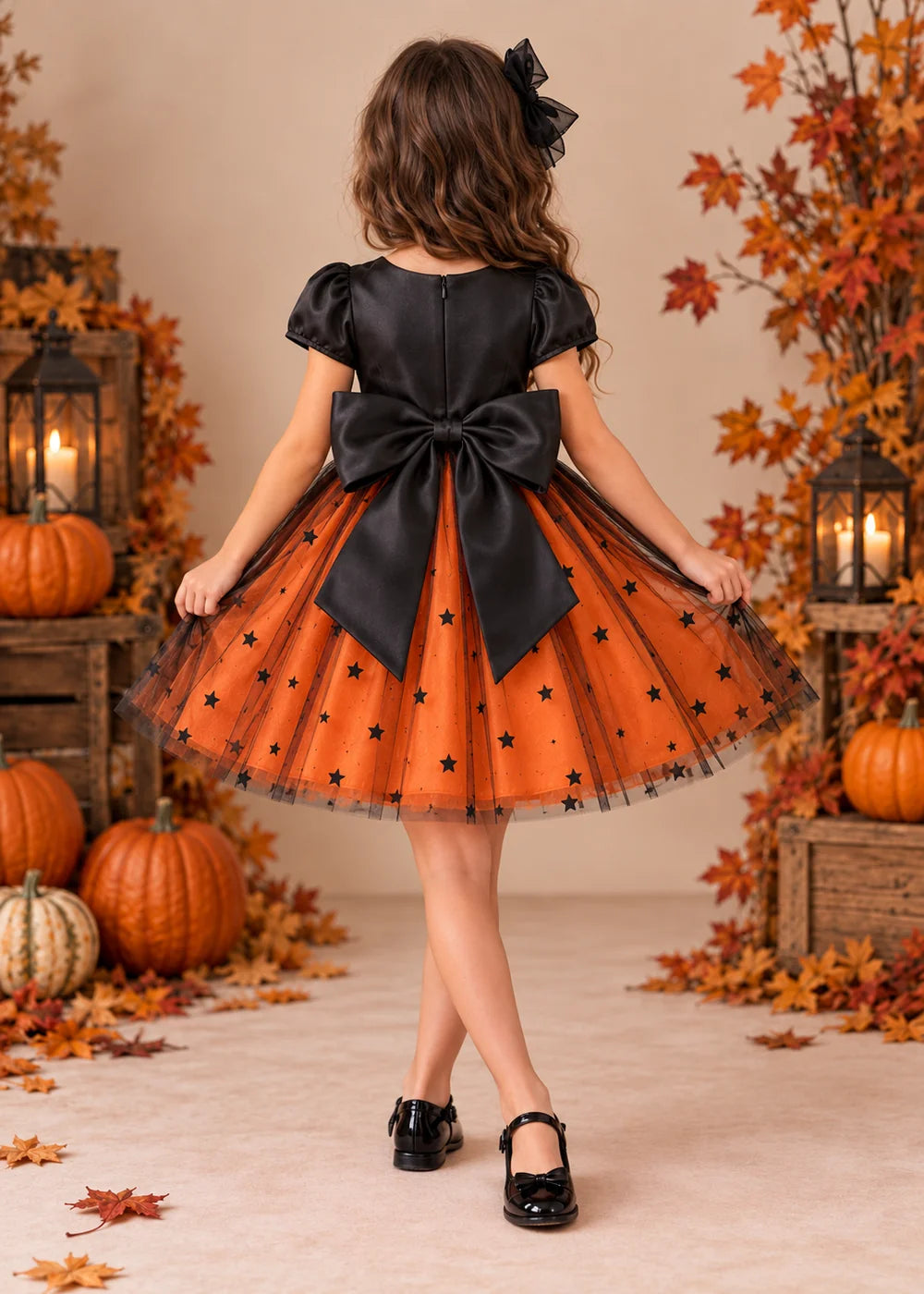 Back view of the orange and black flower girl dress.