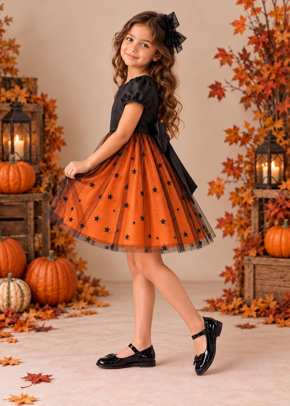 Detail view of the orange and black flower girl dress.