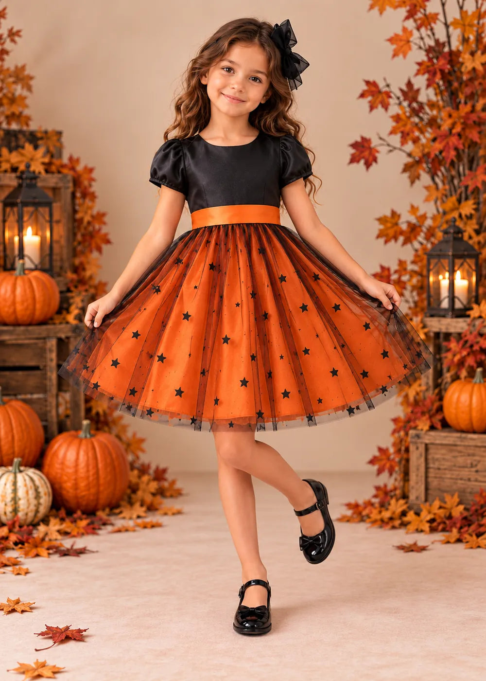 Front view of the orange and black flower girl dress.