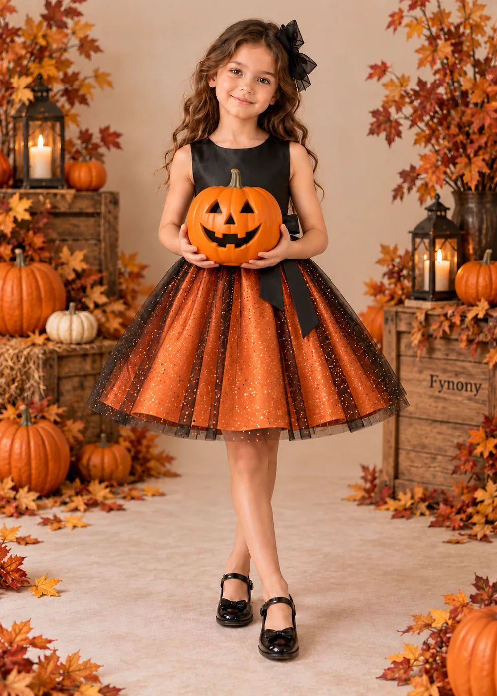 Detail view of the orange and black flower girl dress.