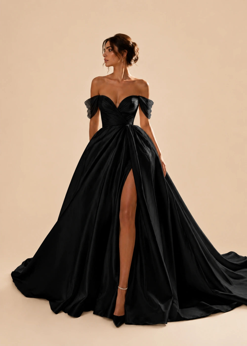Front view of the black off-the-shoulder A-line gown with a corset bodice, high slit, and train