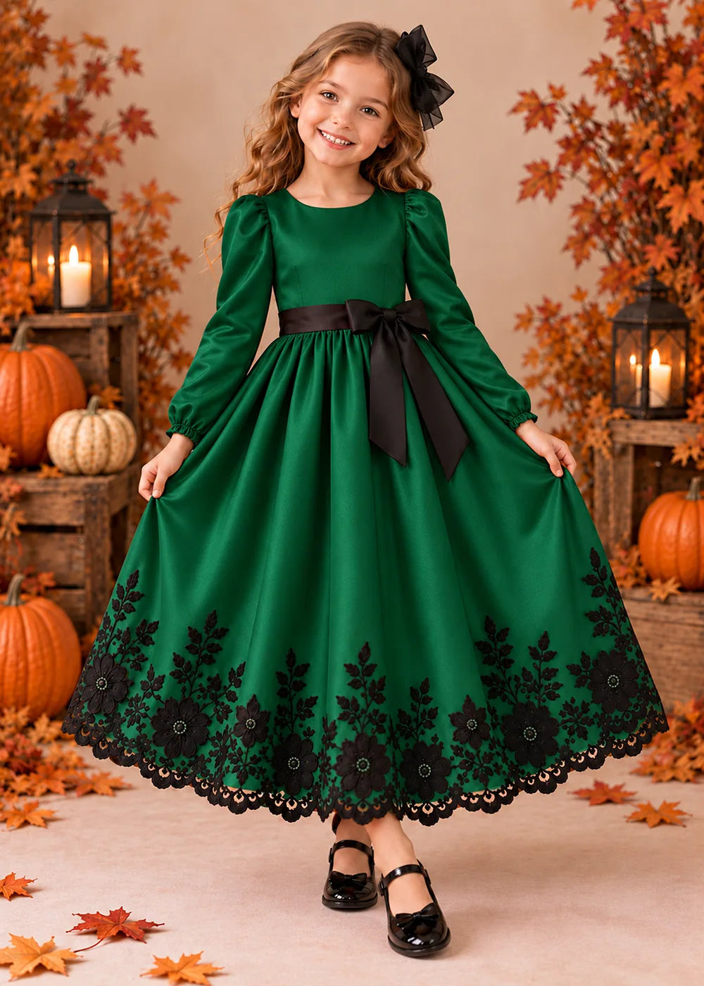 Front view of a emerald green long-Sleeve Flower Girl Dress with Black Floral Hem.