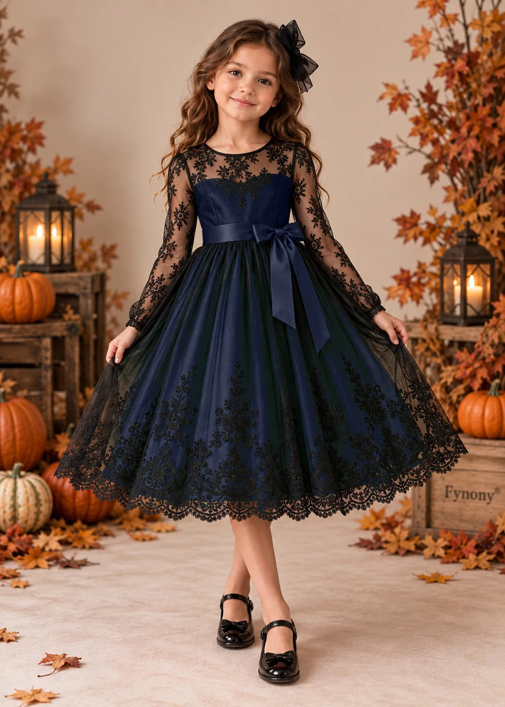 Front view of a navy blue flower Girl Dress with Black Lace and Long Sleeves.
