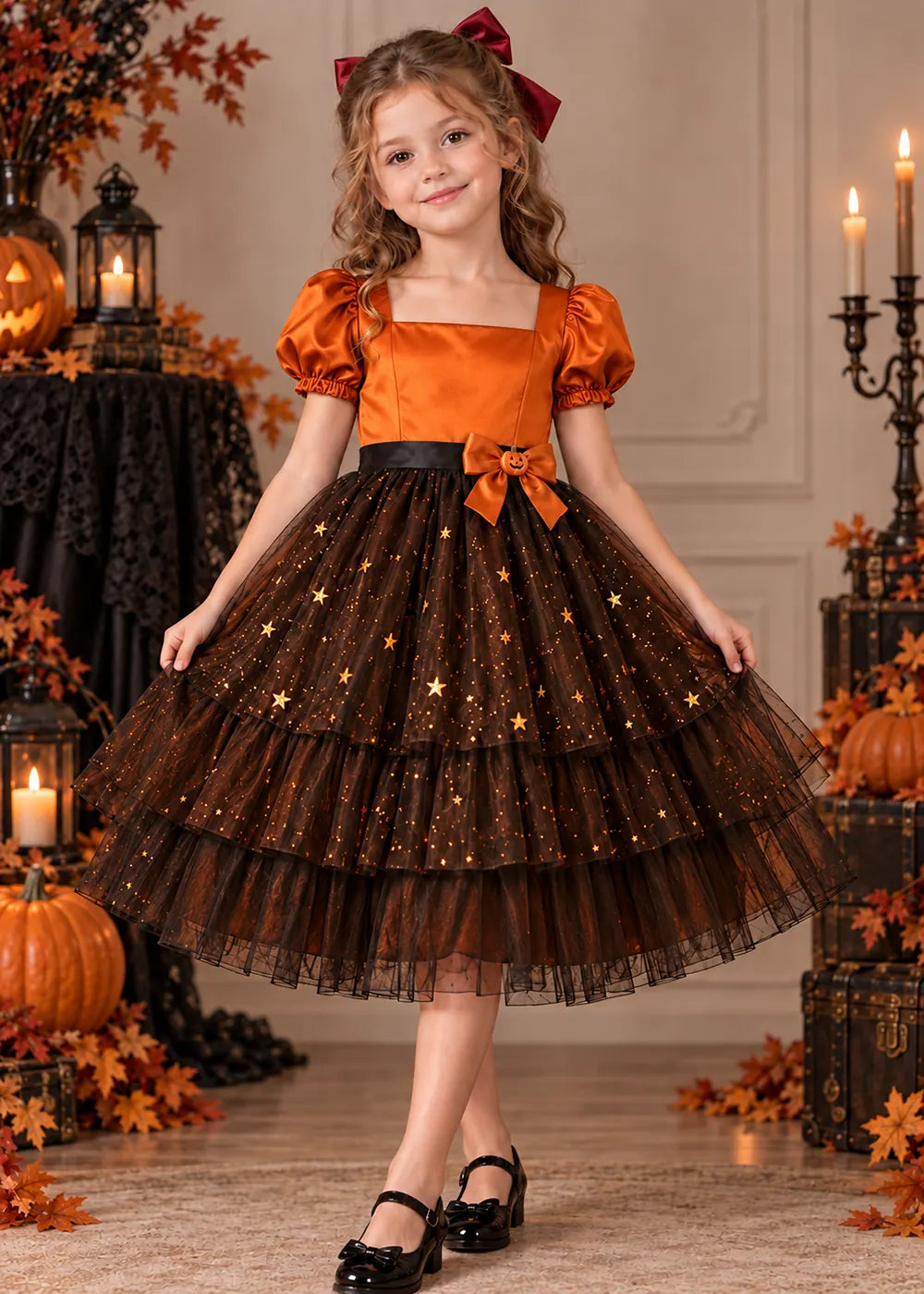 Front view of a pumpkin orange starry Flower Girl Dress.