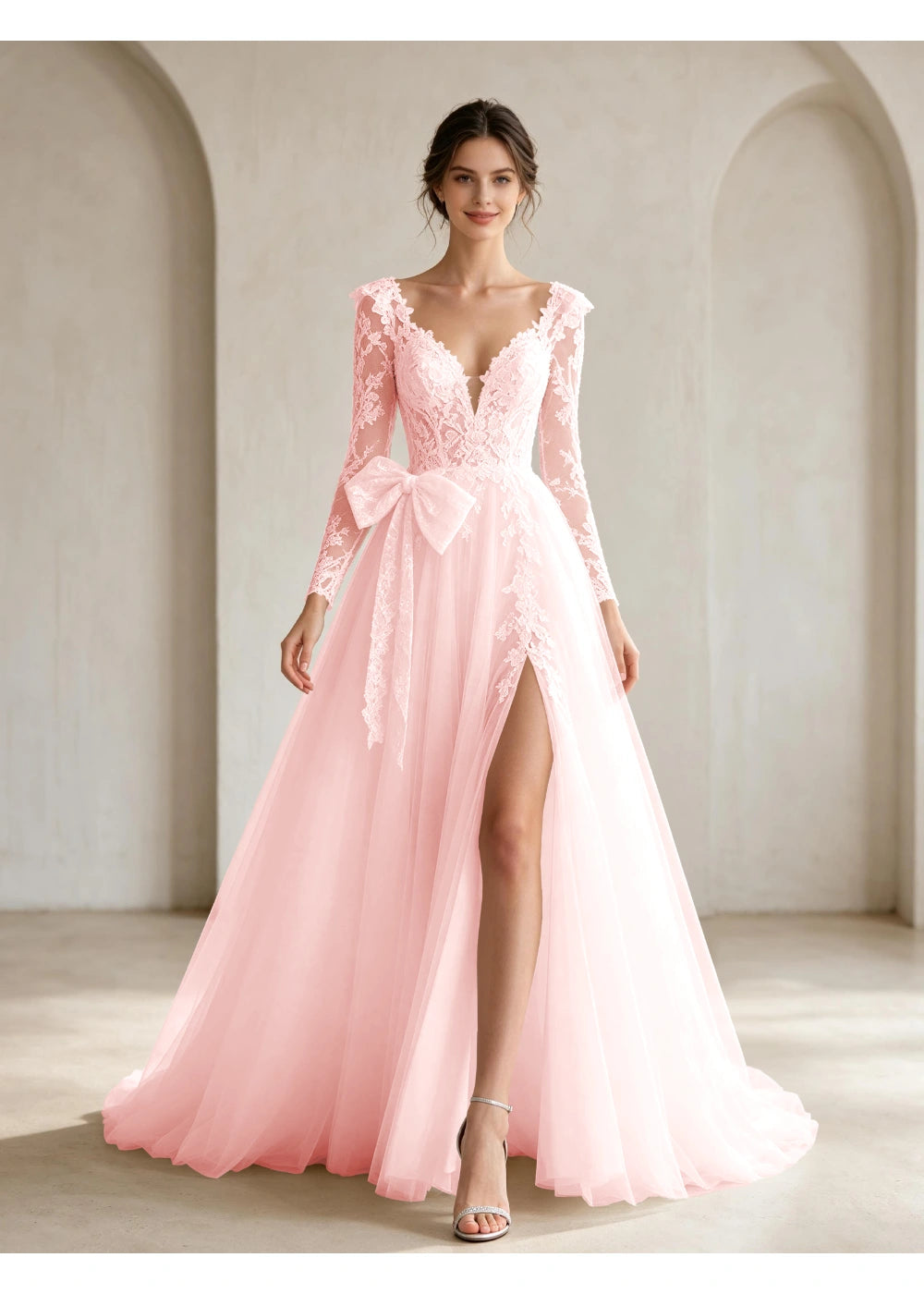 Front view of the blush pink lace front bow slit gown with the same bridal silhouette
