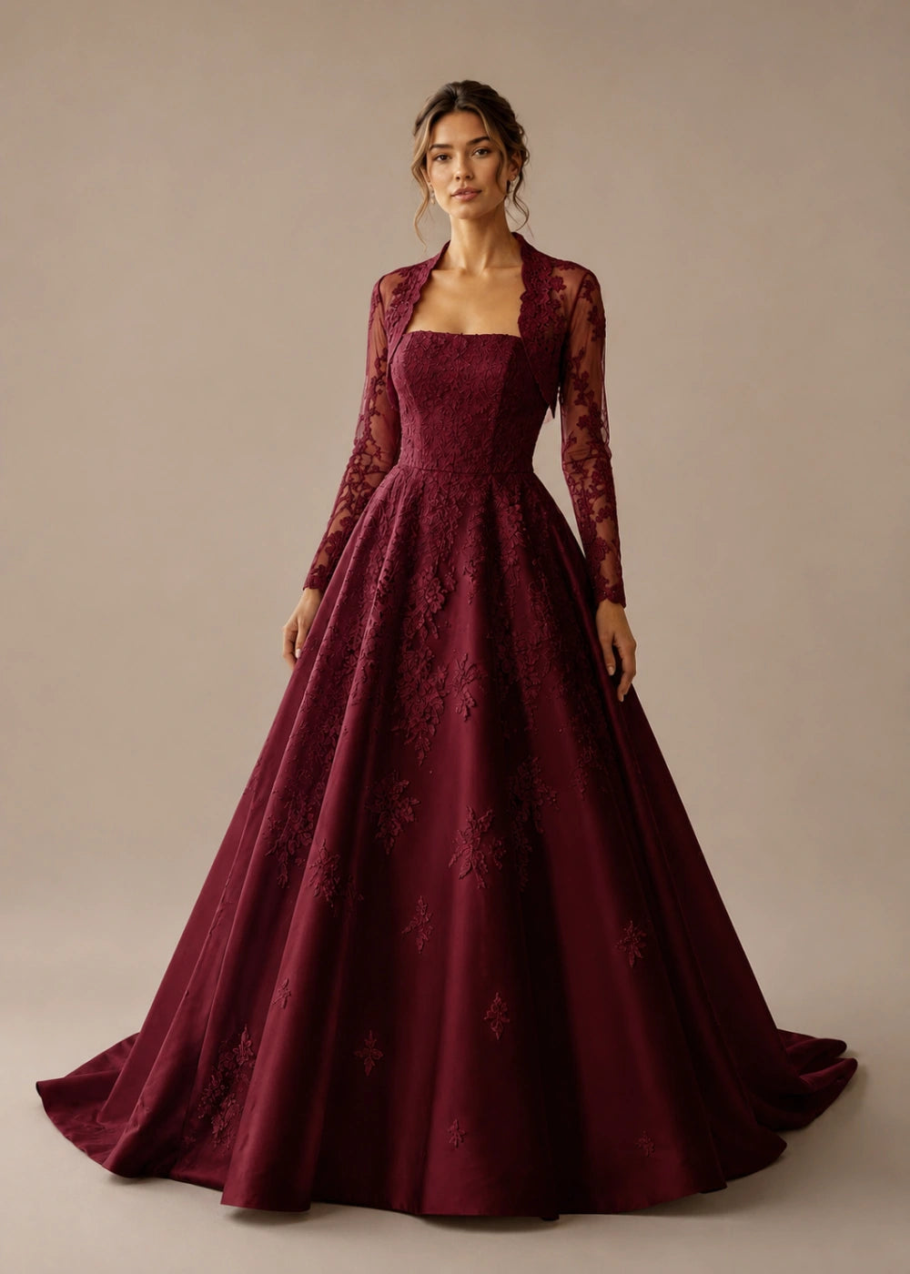 Front view of the burgundy square-neck A-line gown with a long-sleeve lace bolero-style overlay