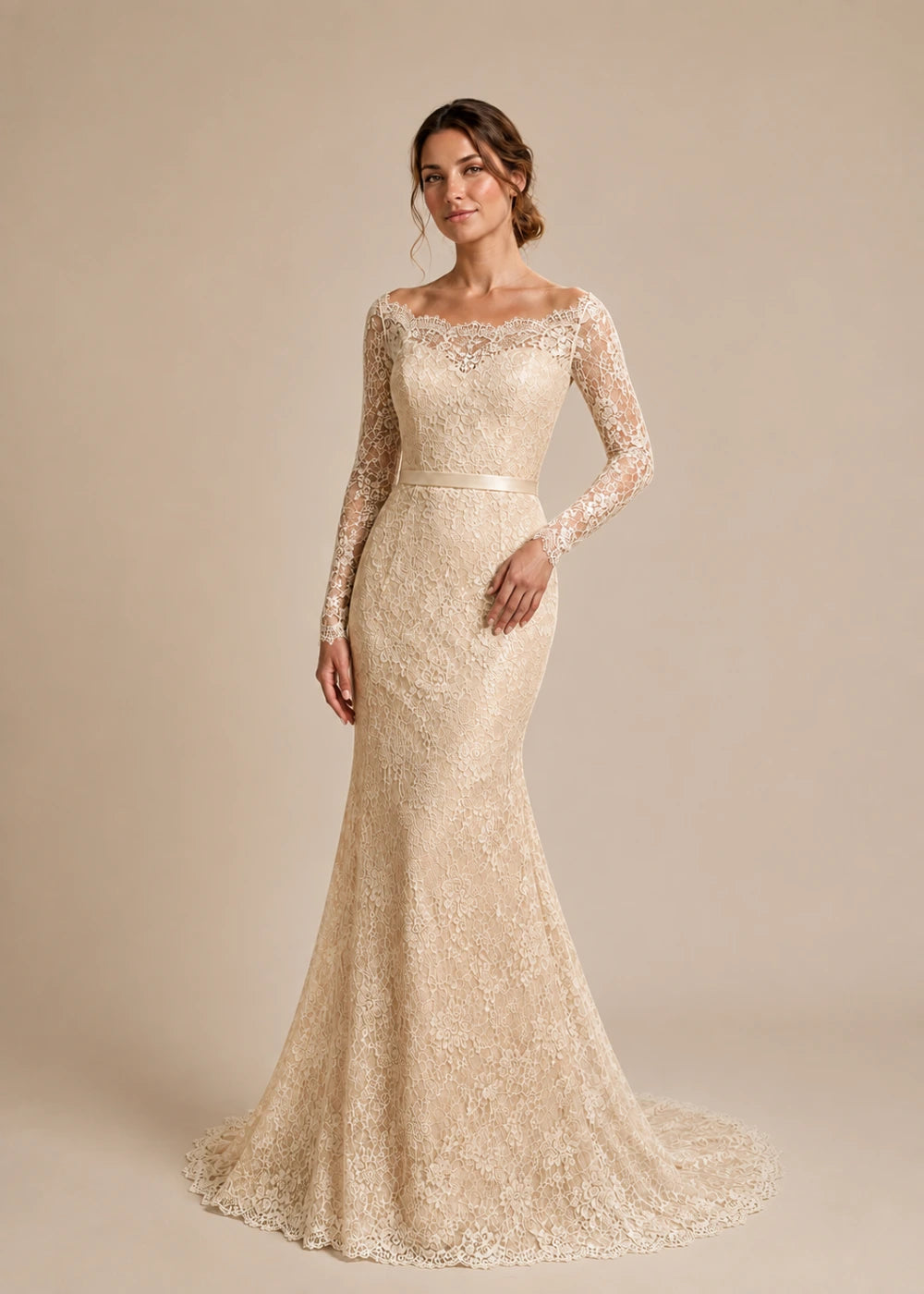 Front view of the champagne illusion-neck mermaid gown with long floral-lace sleeves and a flared train