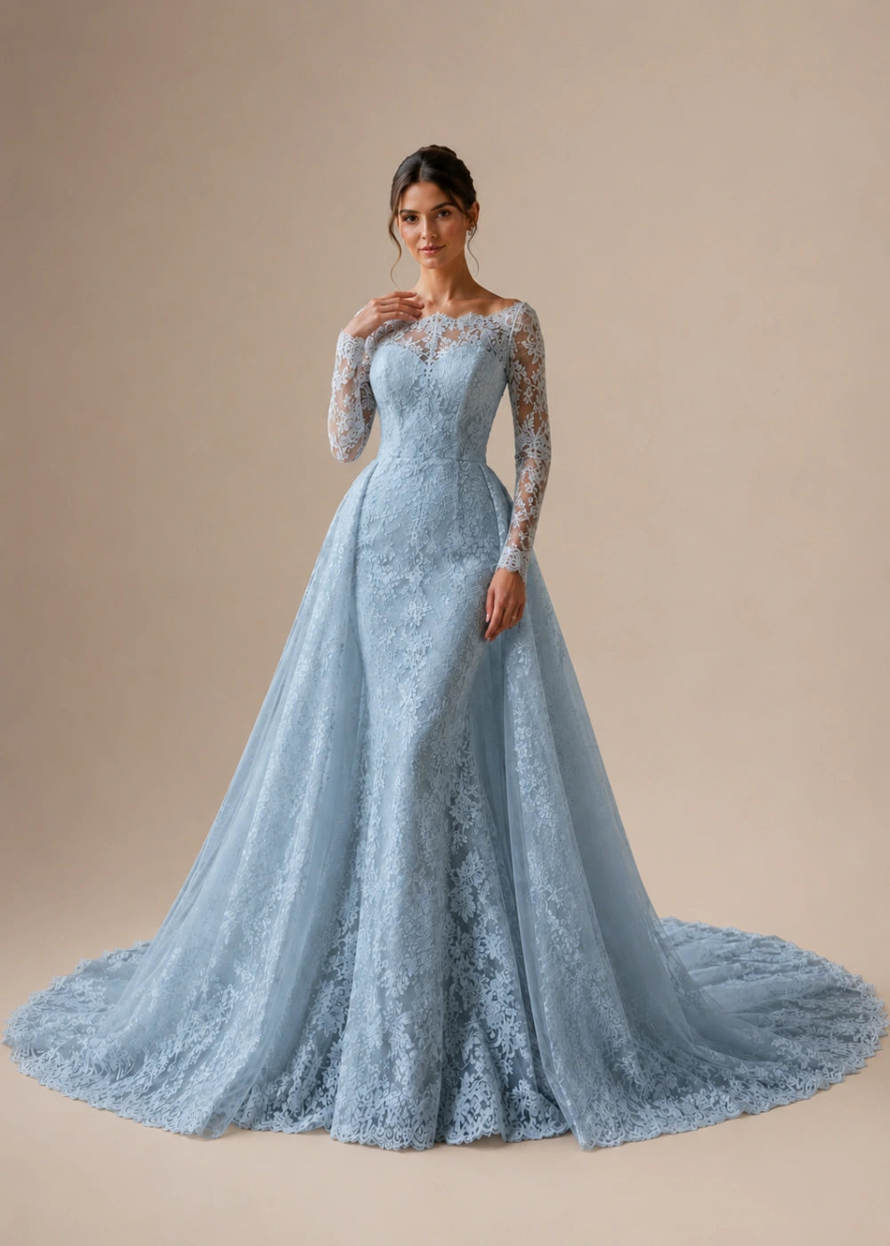 Front view of the dusty blue illusion-neck A-line gown with all-over floral lace, long sleeves, and a train