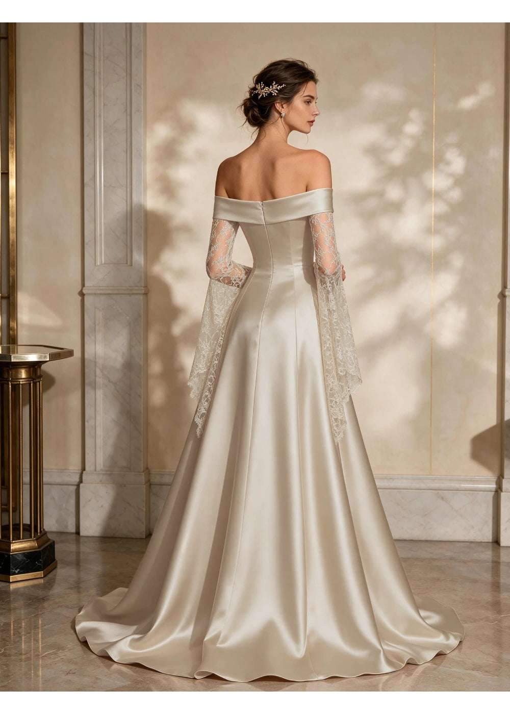 Back view of the ivory gown showing the straight shoulder band, hanging lace panels and satin train