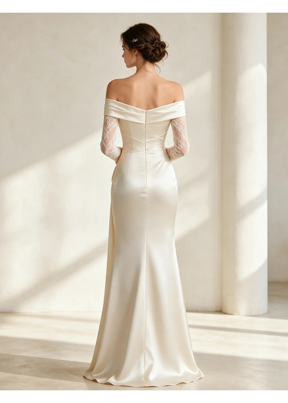 Back view of the ivory off-shoulder gown showing a smooth fitted satin skirt and lace sleeves