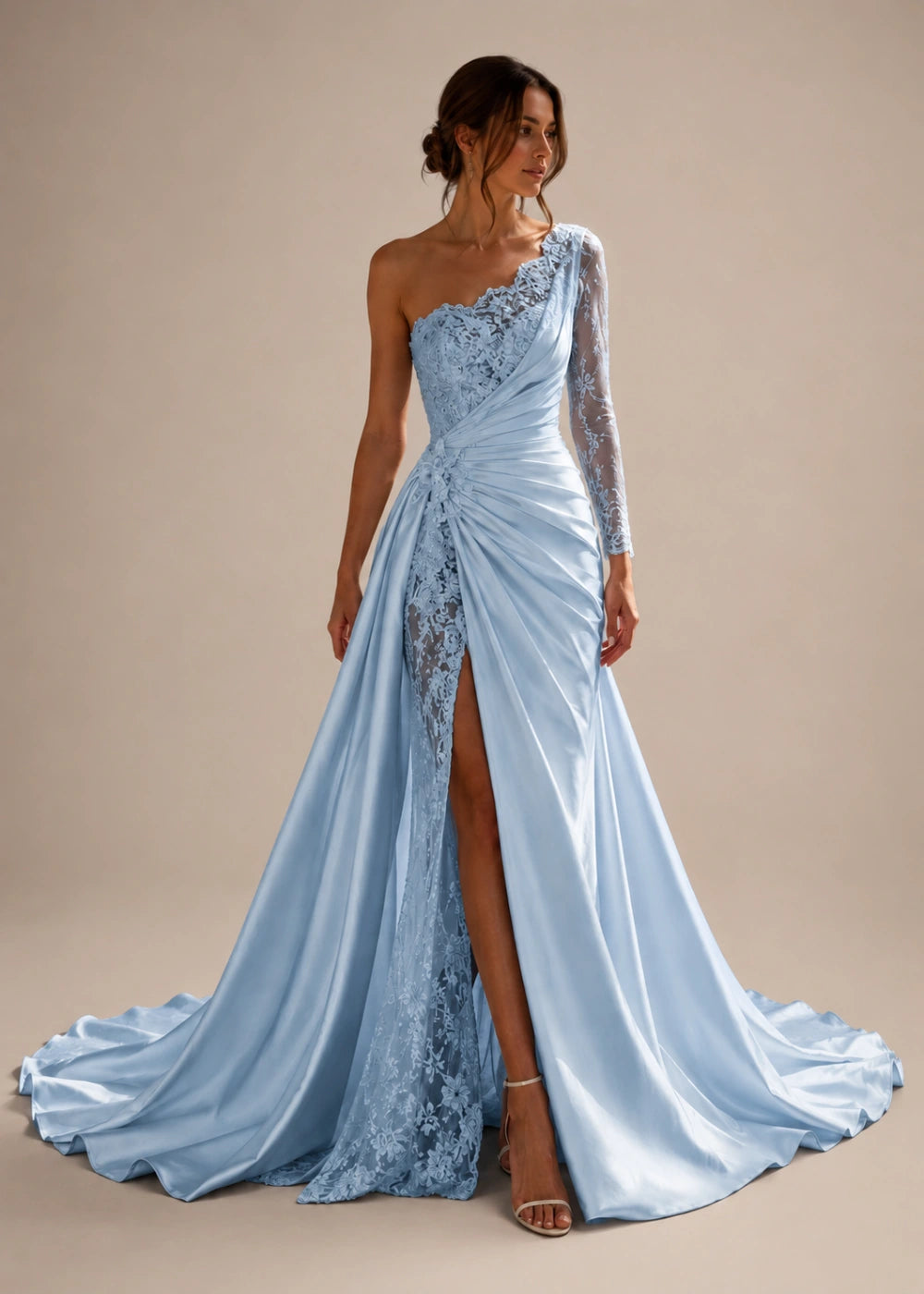 Front view of the light blue one-shoulder fitted gown with one long lace sleeve, a thigh-high slit, and a train