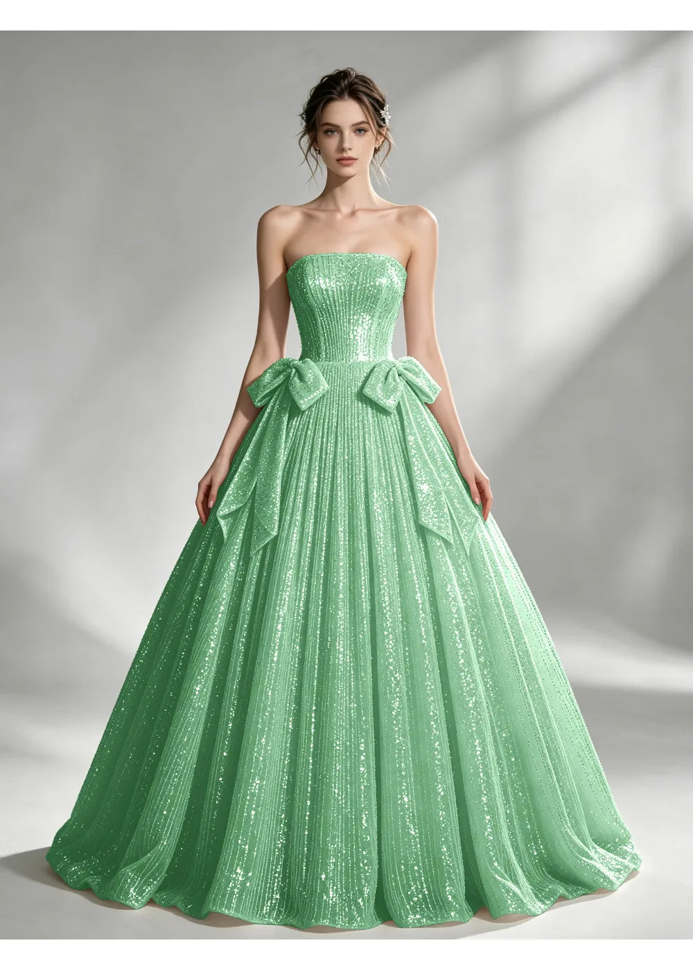 Front view of the mint green sequin twin bow gown with the same bridal silhouette