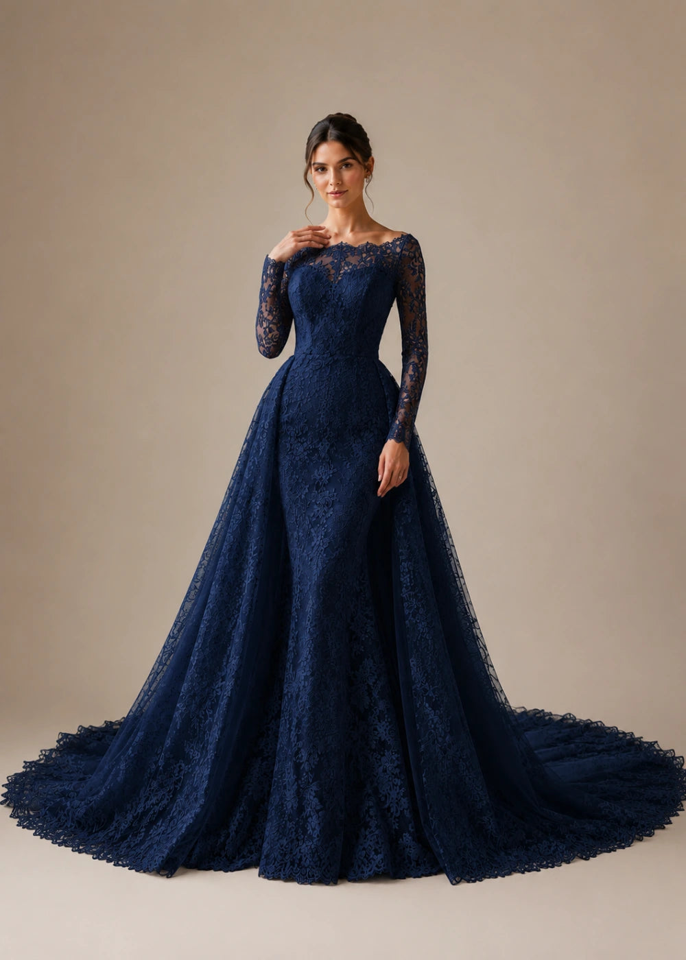 Front view of the navy blue illusion-neck A-line gown with all-over floral lace, long sleeves, and a train
