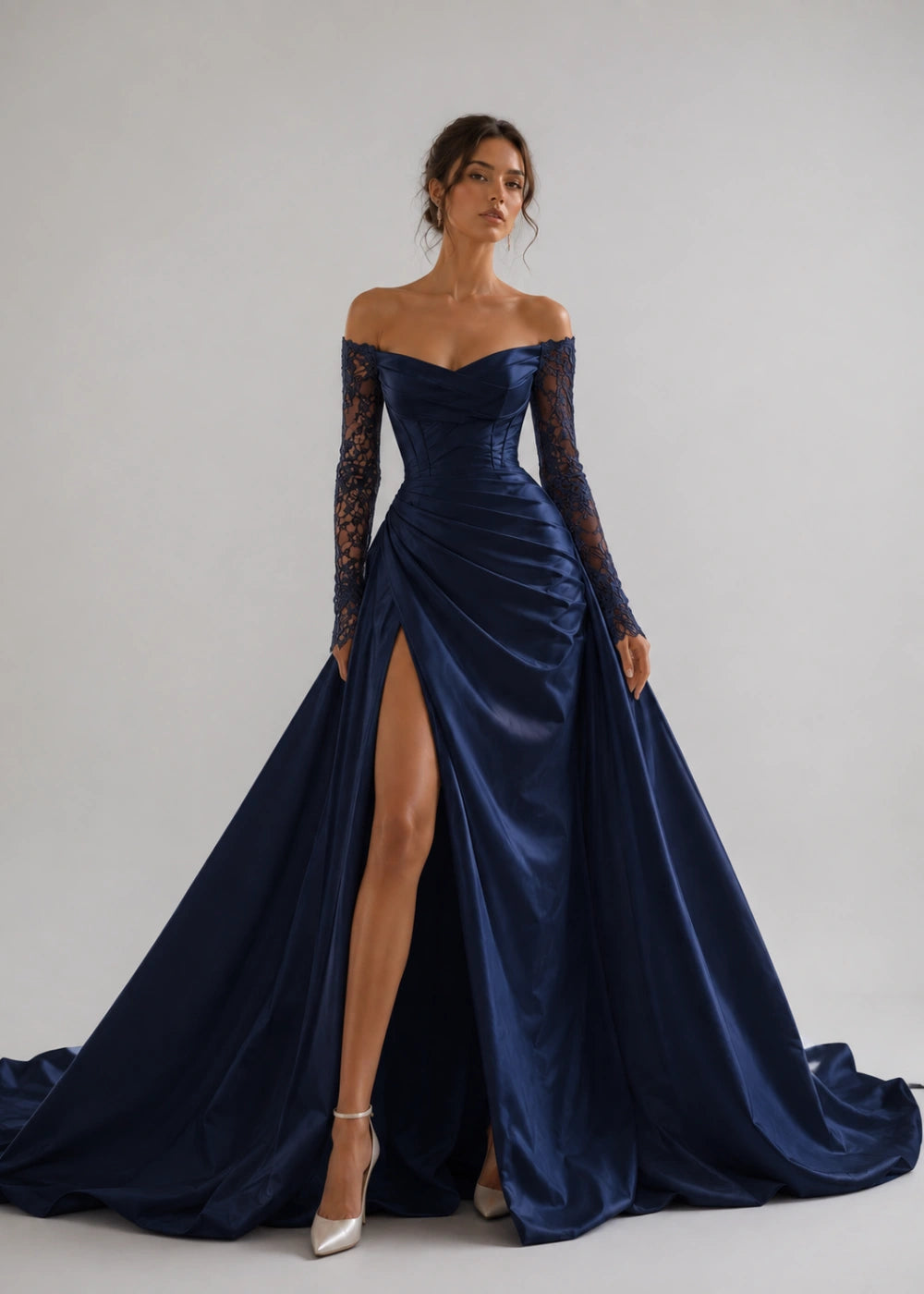 Front view of the navy blue off-the-shoulder A-line gown with long lace sleeves and a thigh-high slit