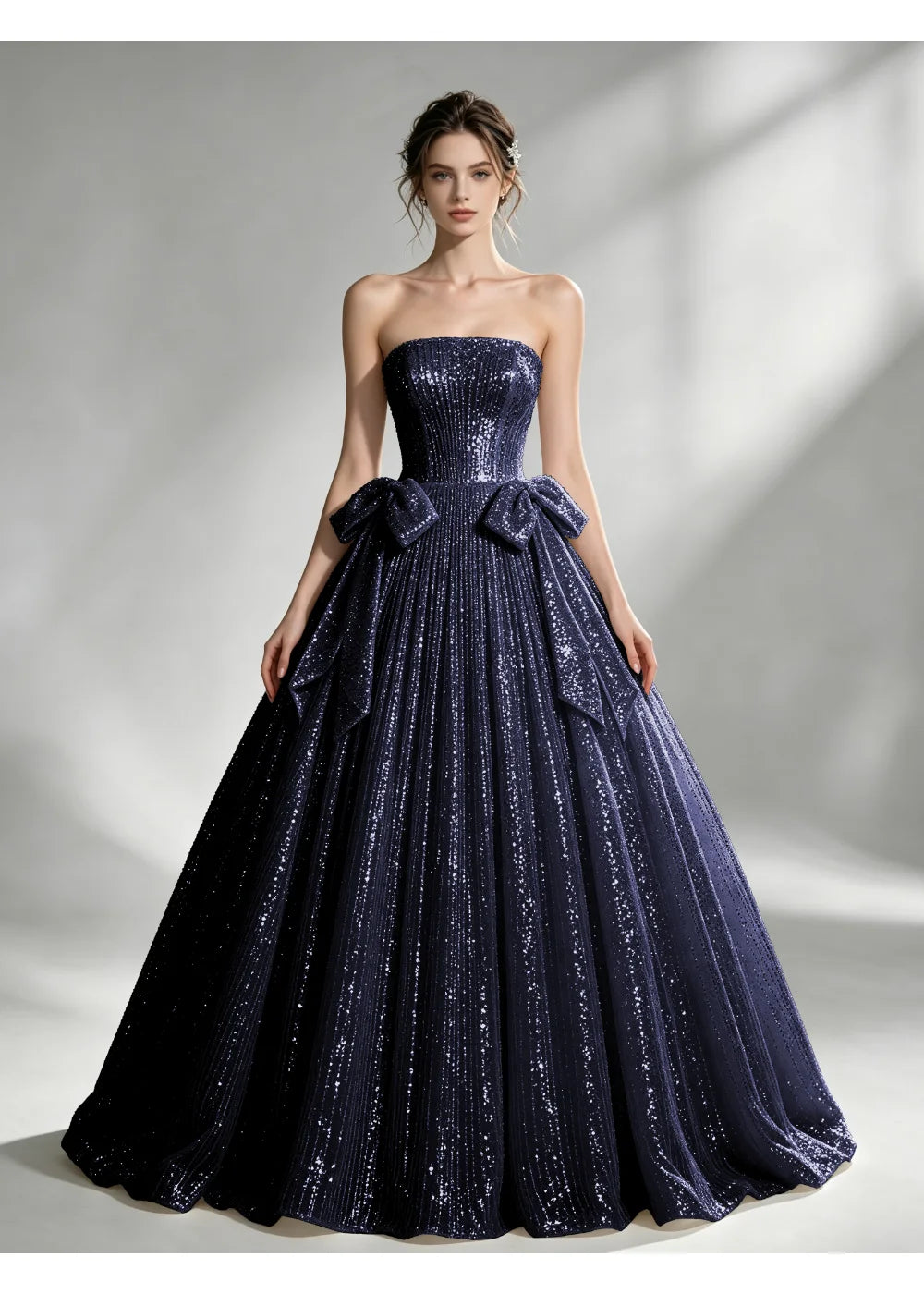 Front view of the navy blue sequin twin bow gown with the same bridal silhouette