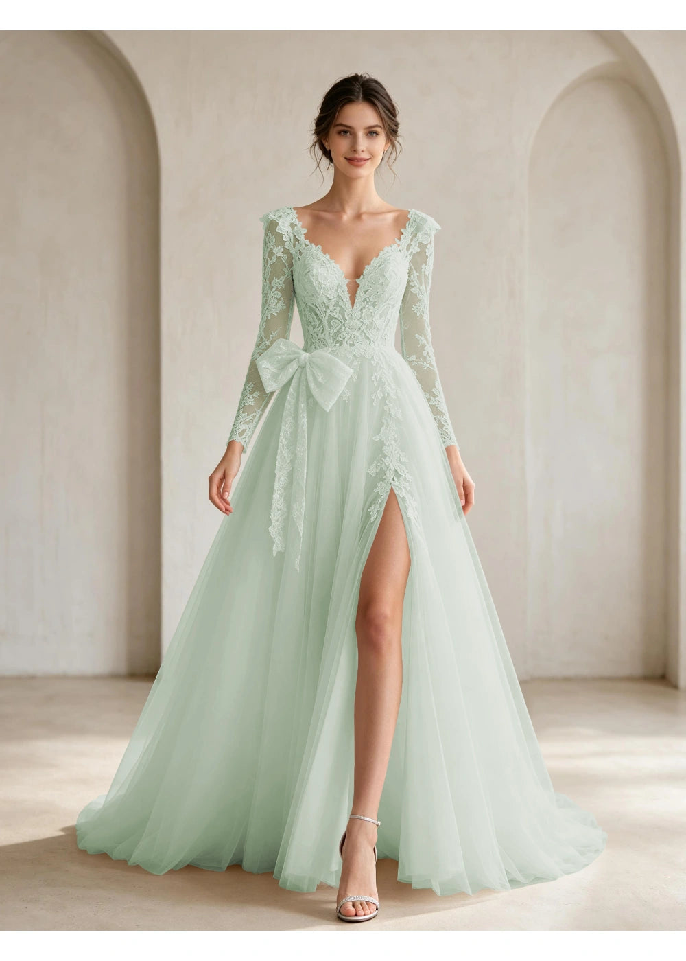 Front view of the sage green lace front bow slit gown with the same bridal silhouette